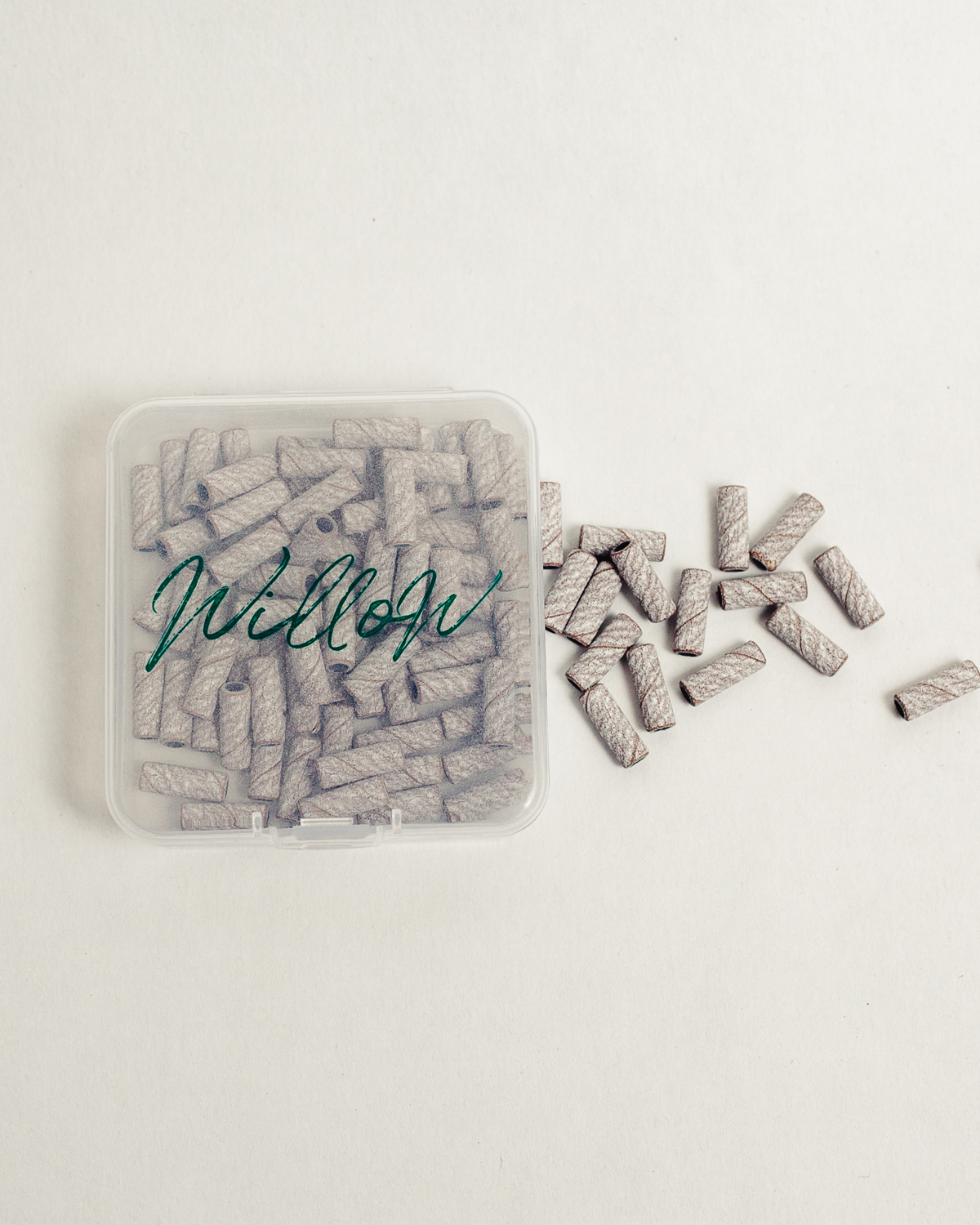 clear container of baby zebra sanding bands