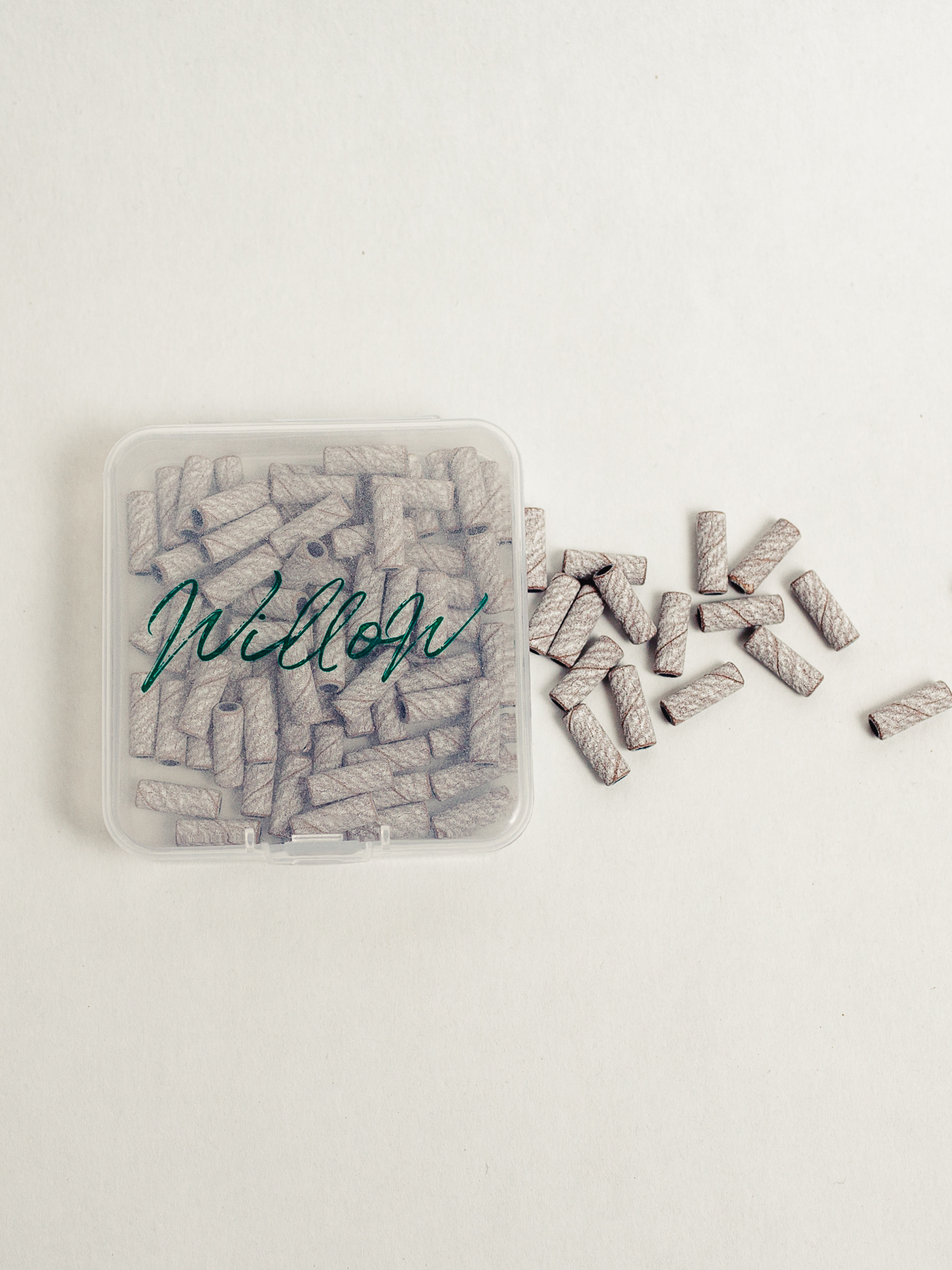 clear container of baby zebra sanding bands