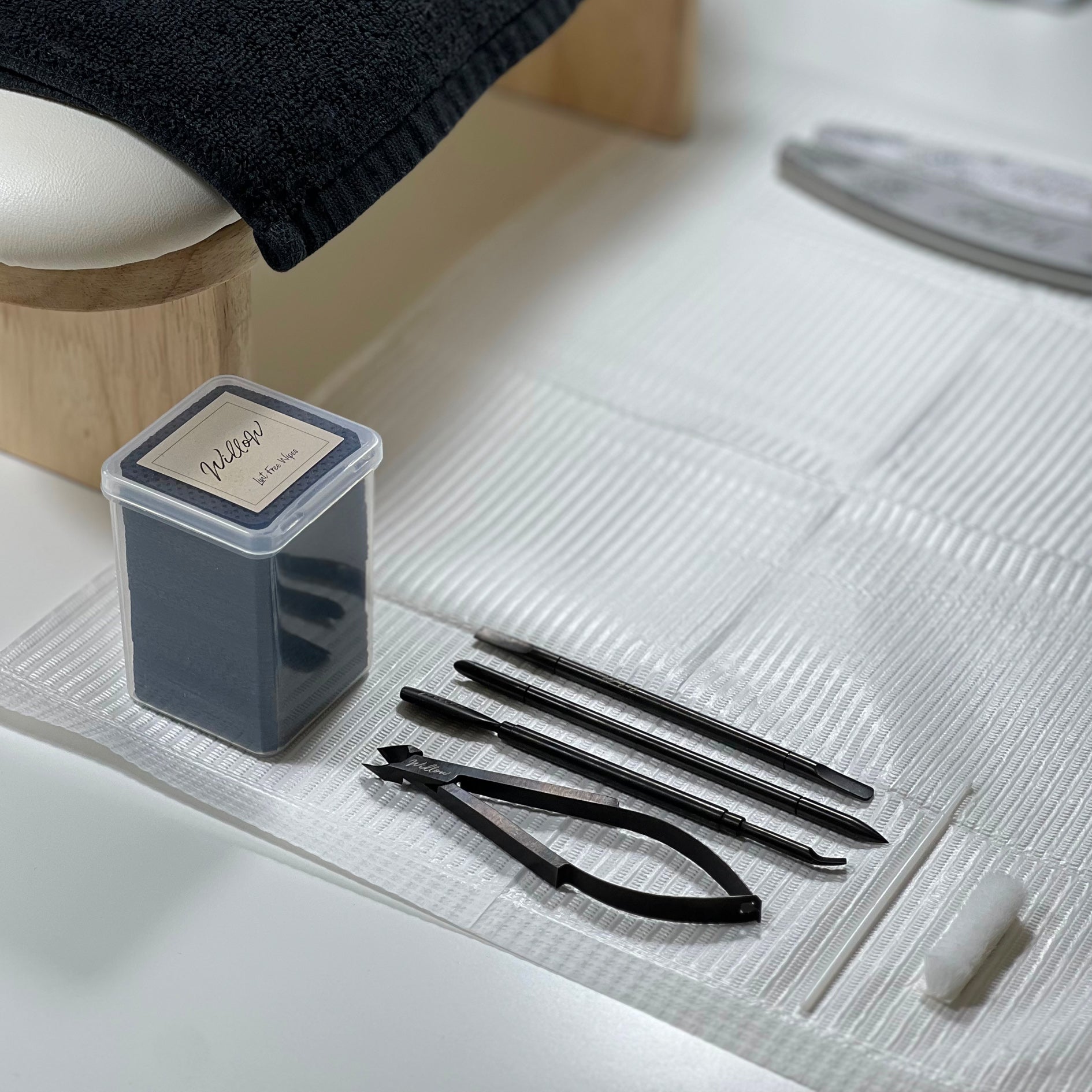Willow lint free wipes shown on a desk flat-lay