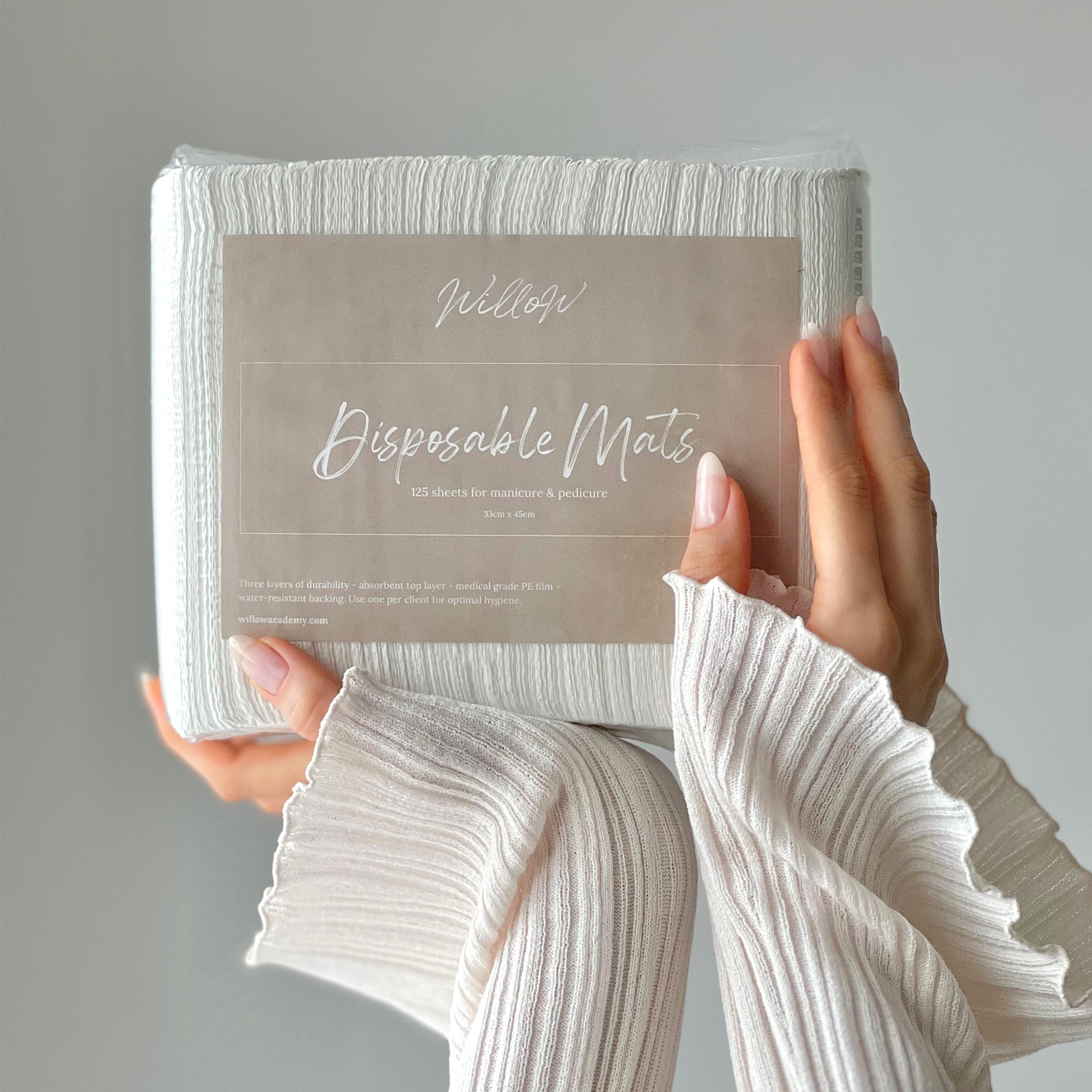 a pack of 125 manicure and pedicure mats with Willow branding