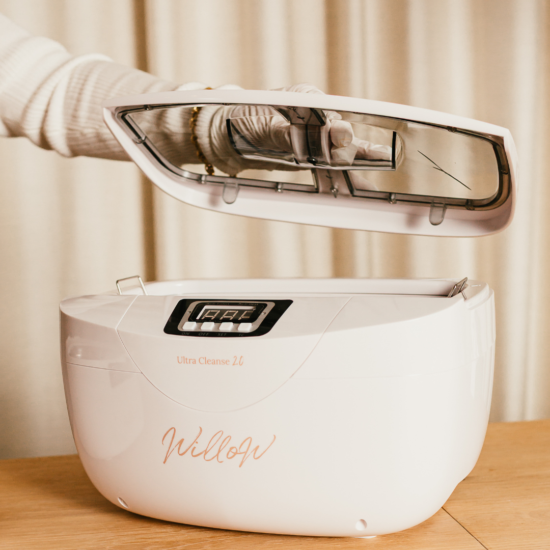 white ultrasonic cleaner with nude branding and removable lid