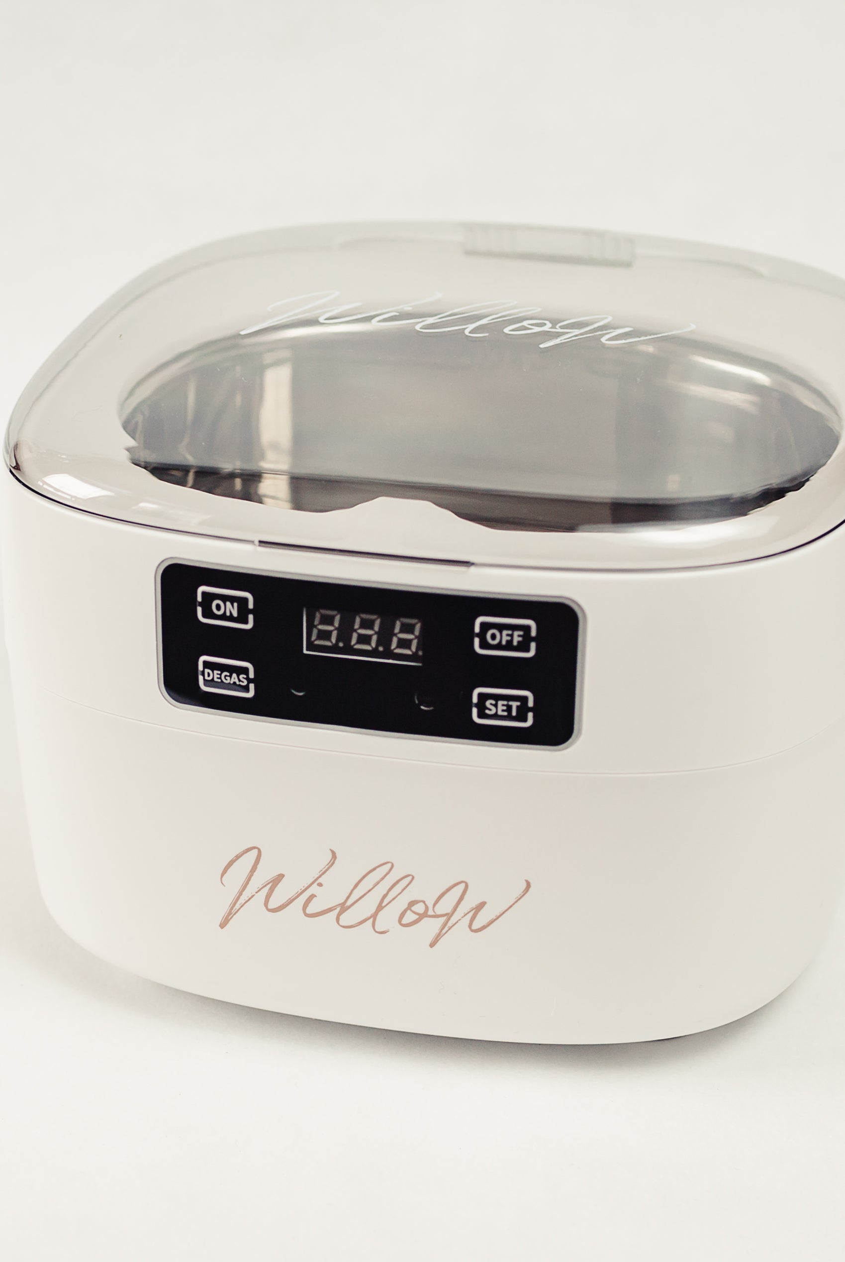 White Ultrasonic cleaner with nude branding and digital display
