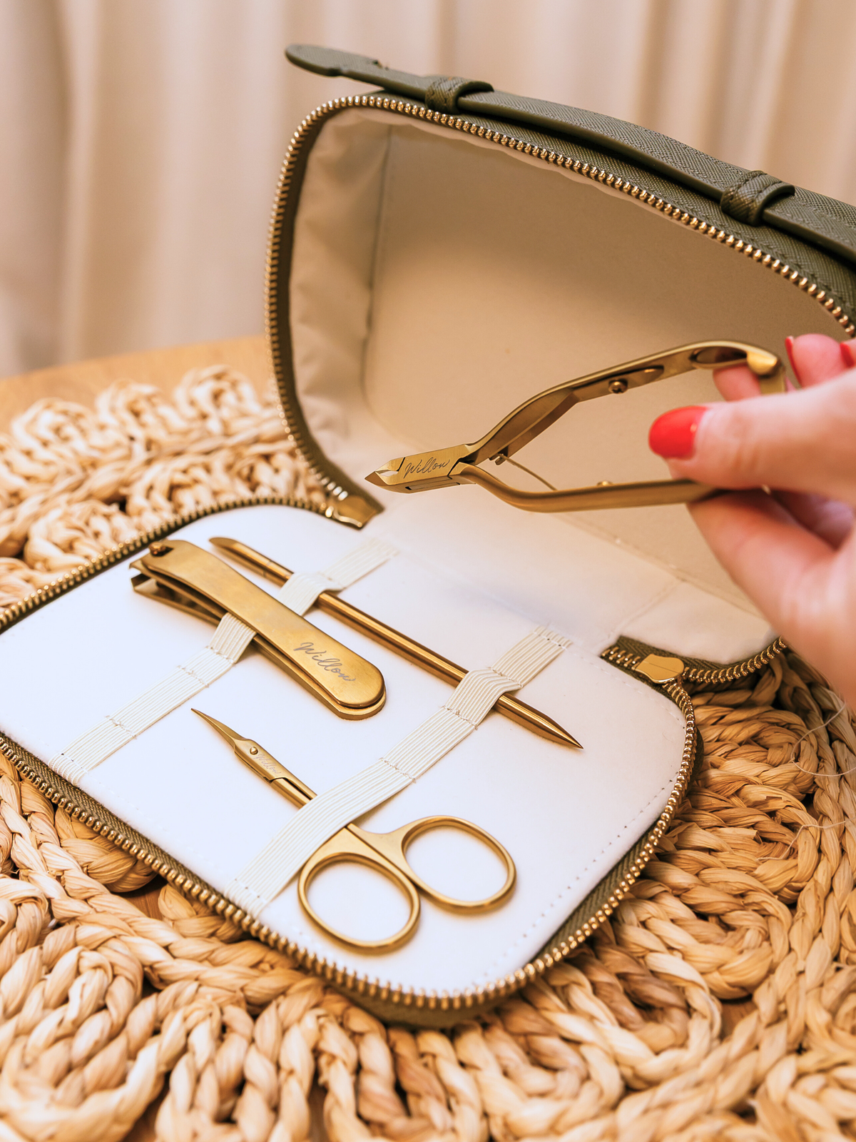 gold manicure tools in khaki travel case