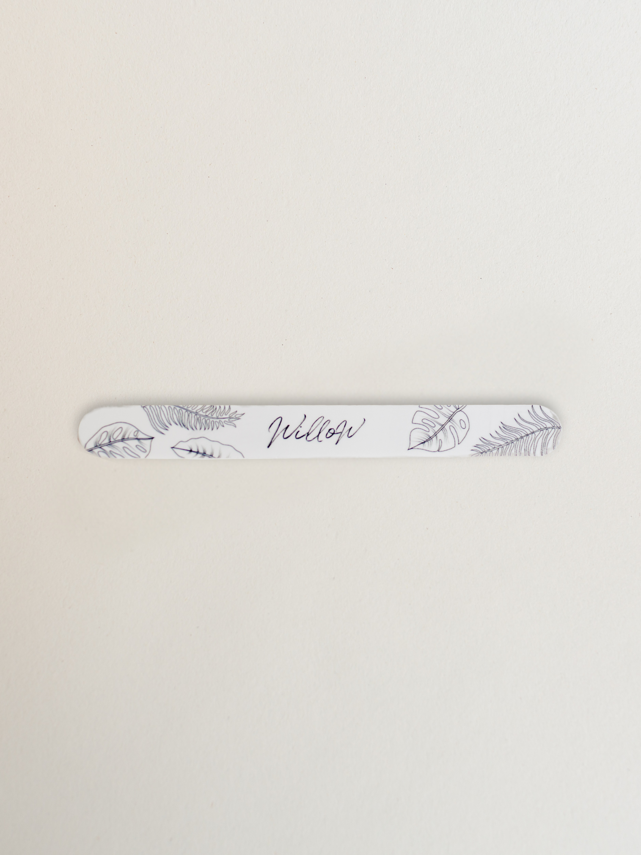 nail file base with leaf pattern for use with the file and go system