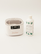 White ultrasonic cleaning machine with cleaning solution 