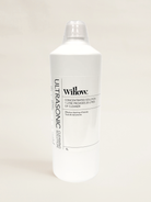 A 1-liter white plastic bottle of Willow Ultrasonic Sewing Cleaner with a clear cap, shown against a plain light beige background.