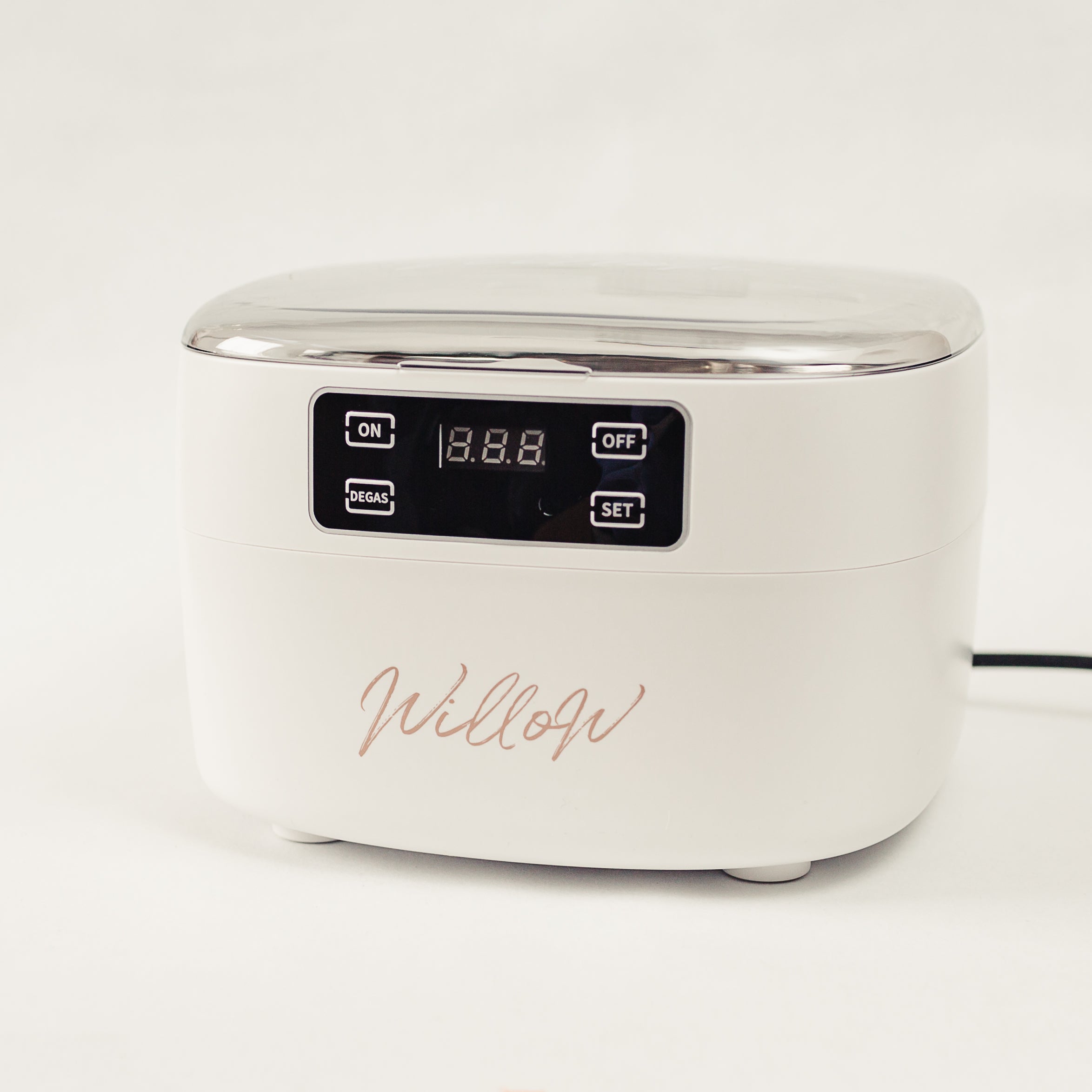 white ultrasonic cleanser with nude branding 