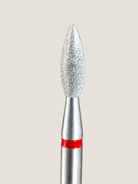 a close up of a platinum e-file bit, used to lift the proximal nail fold 