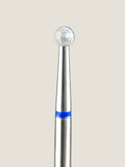 a close up of a platinum e-file bit . A ball shaped bit used for removing cuticle 